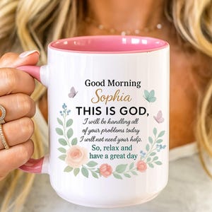 Personalized Christian coffee mug with pink interior and floral wreath, features 'Good Morning Sophia' Bible verse.