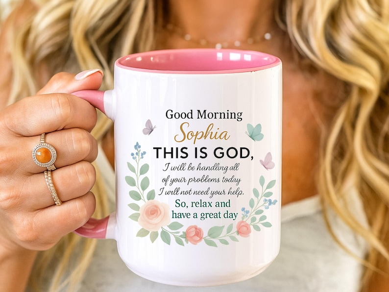 Personalized Christian coffee mug with pink interior and floral wreath, features 'Good Morning Sophia' Bible verse.