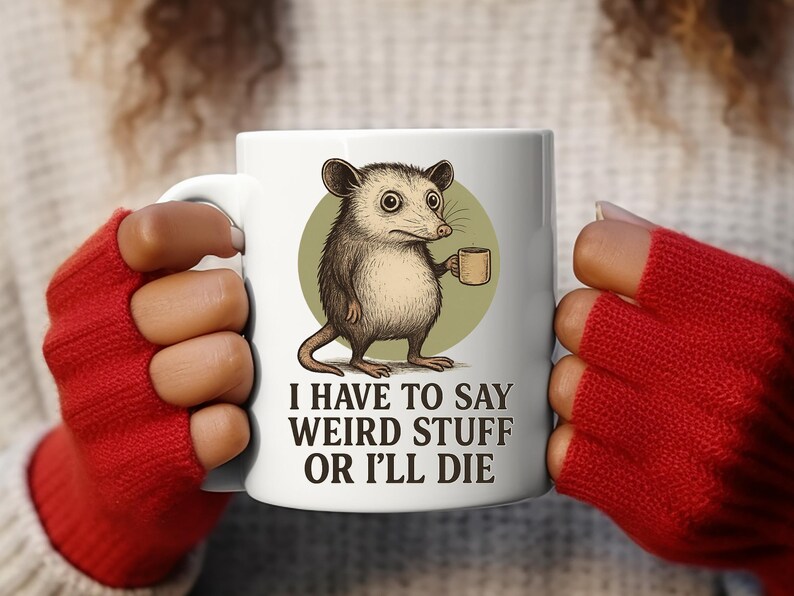Funny possum mug featuring a cartoon possum holding a cup with a weird stuff quote; quirky office humor mug, coworker gift.