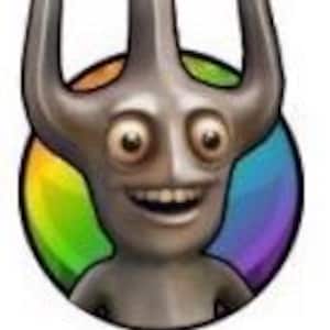 Może przedstawiać: Kreskówkowa ilustracja szarego stworzenia z dużymi oczami i szerokim uśmiechem. Stworzenie ma trójzębną głowę i jest osadzone na okrągłym tle z gradientem tęczy.