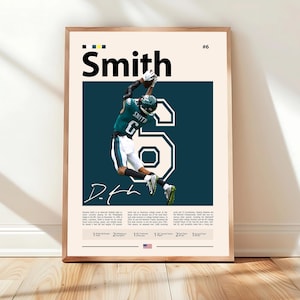 May include: Framed poster featuring a football player in a green and white uniform, catching a ball. The player's name, "Smith," is displayed above a large number "6." The poster has a cream background with dark teal accents and includes text at the bottom.