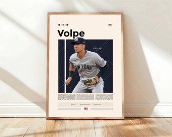 May include: A vertical poster featuring a baseball player wearing a grey New York jersey and a navy cap. The text Volpe and #11 appear at the top. A dark blue rectangular frame surrounds the player, with a signature and descriptive text below.