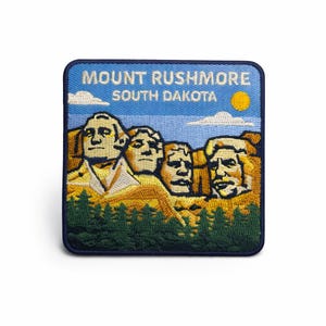 May include: A trio of ceramic mugs with a speckled, matte finish in cream, light grey, and dark grey. Each mug features a simple, minimalist design, ideal for tea or coffee.