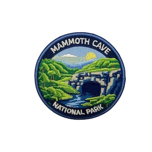 May include: Embroidered patch featuring a scenic view of Mammoth Cave National Park. The design includes a cave entrance, river, green trees, blue mountains, and a yellow sun. The text "Mammoth Cave National Park" is in a blue circular border.