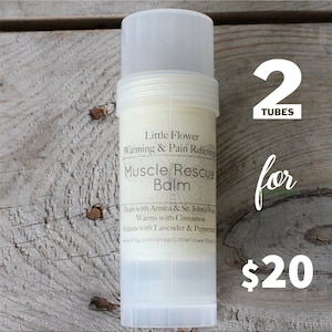 May include: Two tubes of muscle rescue balm, labeled "Little Flower Warming & Pain Relieving Muscle Rescue Balm". The balm is made with arnica, St. John's Wort, cinnamon, lavender, and peppermint. The product is priced at $20.
