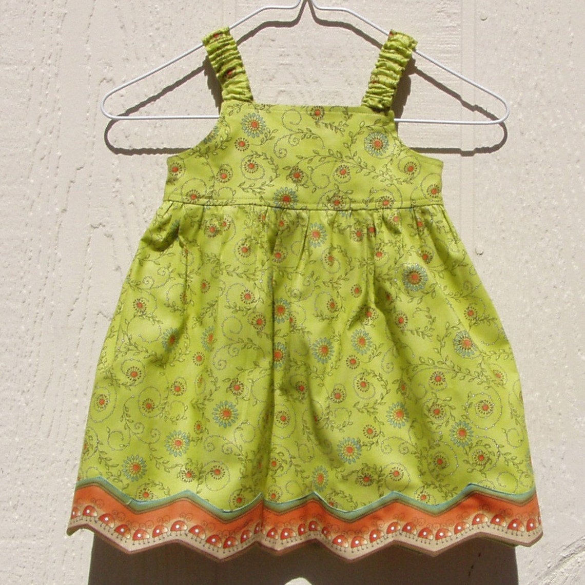 Alna Baby Dress in Green Clover & Ladybugs main image 1
