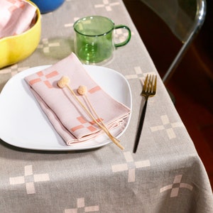 100% Linen Tablecloth 'Plus 2' in Cream Delight your guests and elevate your tablescape with this hand-printed linen tablecloth image 1