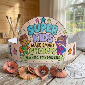 May include: A semi-circular paper crown featuring the text SUPER KIDS MAKE SMART CHOICES BE A HERO. STAY DRUG FREE. The design includes colorful illustrations of two children in superhero costumes, various stars, and ribbon icons.