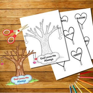 Peut inclure: Une page à colorier avec un motif d'arbre, des ornements en forme de cœur et le texte "God Loves Me Always". D'autres pages présentent des motifs en forme de cœur avec des mots comme "Bénédiction" et "Pardon". Des ciseaux rouges et des crayons de couleur sont également visibles.