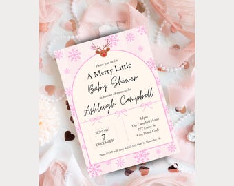 May include: A baby shower invitation with a pink and cream color scheme. The invitation features the text "A Merry Little Baby Shower" with the name "Ashleigh Campbell". The design includes snowflakes and a reindeer graphic.