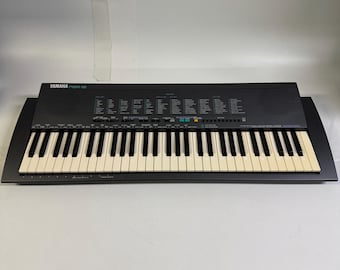 Teclado electrónico Yamaha PSR-19 vintage de los años 80, 61 teclas. Probado y funcionando. Incluye adaptador de corriente.