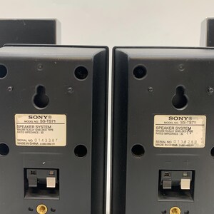May include: Two black Sony speaker system units, model SS-TS71, featuring a magnetically shielded design with a rated impedance of 3 ohms. Each unit includes a wall-mount keyhole, a spring-clip wire terminal, a threaded insert, and a blue label.