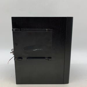 May include: A rectangular black wooden frame with a smooth finish, featuring a central black plastic mounting bracket attached to the back. The frame has a solid construction with visible wood grain texture and a thin wire extending from the side.