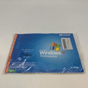 May include: A sealed Microsoft Windows XP Professional software package. The blue and white package has the Windows XP logo and text. The package is for distribution with a new Fujitsu Siemens PC only.