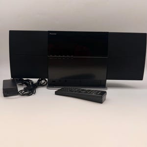 Sistema AV compacto Pioneer X-SMC1-K Slim, color negro, moderno y minimalista, estéreo, con reproductor de CD y DVD.
