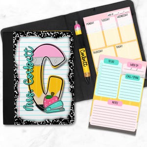 May include: A black composition notebook cover with a notepad, pen, and small bottle. The notepad has a pencil and apple design with the text "Mrs. Corbett". The pen has the name "Corbett" on it. There are also two notepads with to-do lists.