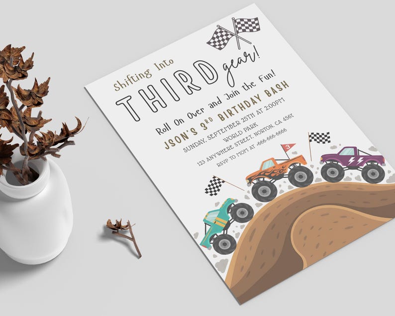 May include: A white invitation with the text "Shifting Into THIRD gear!" and "JSON'S 3RD BIRTHDAY BASH". The invitation features illustrations of monster trucks racing on a dirt track, with checkered flags.