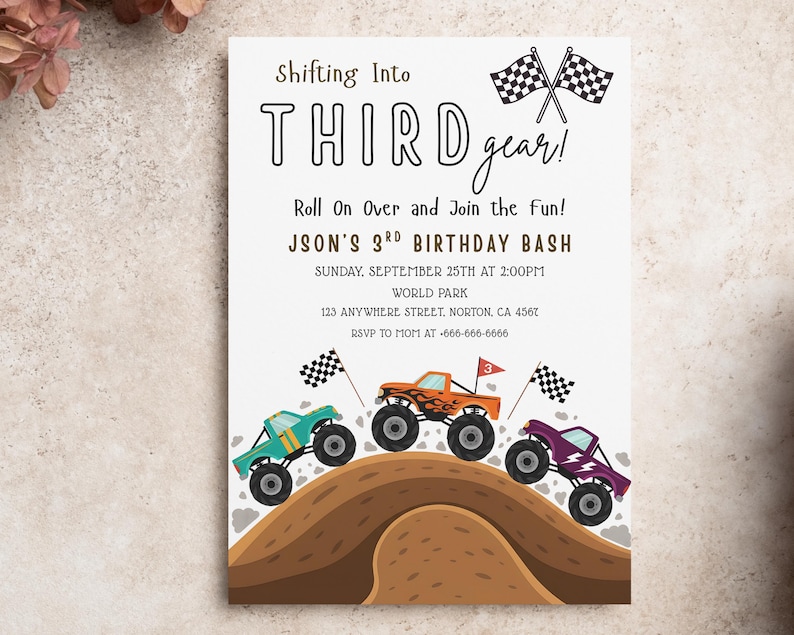 May include: A birthday party invitation with the text "Shifting Into THIRD gear!" and "JSON'S 3RD BIRTHDAY BASH". The invitation features illustrations of three colorful monster trucks racing over a brown hill, with checkered flags.