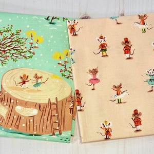 May include: Two fabric panels with whimsical mouse illustrations. One panel features a winter scene with mice dancing on a tree stump. The other panel has mice in various outfits on a peach background. The fabrics are likely for crafting or sewing.