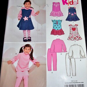May include: A sewing pattern for children's clothing, featuring a variety of styles including dresses, tops, and pants. The pattern includes instructions for sizes 3-8. The pattern is from New Look and has the number 6929.