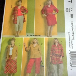 May include: Sewing pattern for a dress and a jacket. The pattern is for sizes 18W-20W-22W-24W. The pattern is from McCall's and the pattern number is M5437.