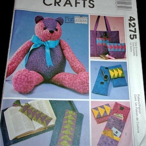 May include: Sewing pattern for a teddy bear, tote bag, envelope, and bookmark. The pattern is designed for use with fat quarters of fabric. The pattern number is 4275.