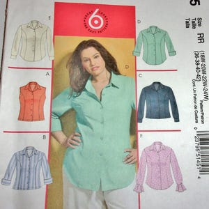 May include: McCall's sewing pattern M5145 featuring six shirt designs. The pattern includes a woman wearing a mint green button-down shirt. The pattern size is RR (18W-20W-22W-24W).