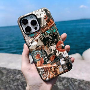May include: A phone case with a Western-themed collage design. The case features images of cowboy hats, a bull skull, and the text "Cowboy Up or Shut Up Baby." The overall aesthetic is vintage and rugged, with a mix of colours.