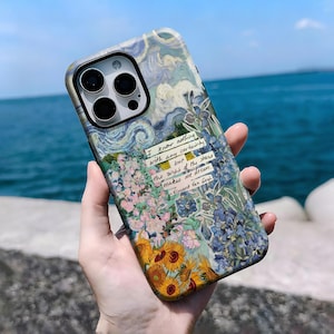 May include: A phone case featuring a colorful floral design with sunflowers, irises, and a starry sky, inspired by Vincent Van Gogh's art. The case includes the quote: "I know nothing with any certainty but the sight of the stars makes me dream."