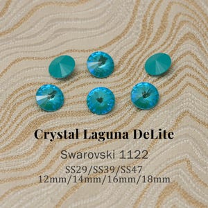 May include: A white ceramic mug with a black handle and the text "But First, Coffee" in a black, bold font. The mug is sitting on a wooden surface. The mug is approximately 4 inches tall.