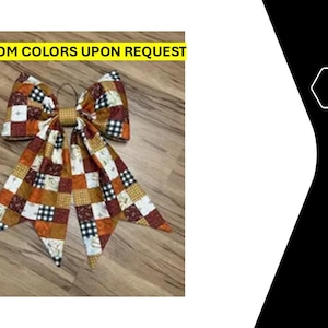 May include: A decorative bow featuring a patchwork pattern of orange, white, black, and brown squares with various prints including buffalo check and wheat stalks. The text CUSTOM COLORS UPON REQUEST is displayed in black letters on a yellow background.