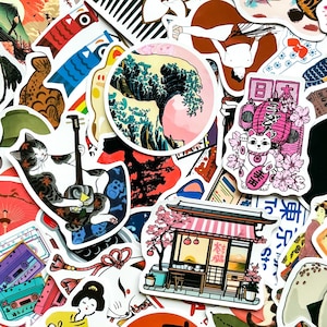 May include: A collection of colorful Japanese-themed stickers. Designs include a cat playing a shamisen, a lucky cat, a wave illustration, a traditional building, and other cultural motifs. The stickers are in various shapes and sizes.