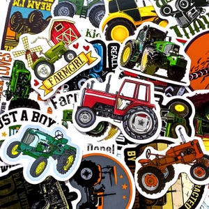 May include: A collection of colorful tractor stickers in various designs. The stickers feature red, green, and yellow tractors, some with the text "FARMGIRL" and "JUST A BOY". The stickers are ideal for decorating notebooks, laptops, or other items.