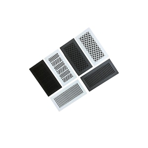 May include: A collection of rectangular air vent covers in black and white. The vents feature various geometric patterns, including diagonal lines, chevrons, and diamond grids. The covers are arranged against a white background.