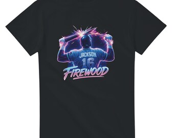 May include: Black t-shirt featuring a baseball player graphic. The design includes the name "Jackson" and the number "16" on the jersey, with the word "Firewood" below. The graphic has a neon color scheme.