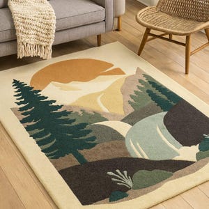 May include: A rectangular rug with a mountain landscape design. The rug features a cream background with a stylized depiction of mountains, trees, and a setting sun in shades of green, brown, and yellow.