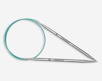 May include: A pair of silver circular knitting needles with a turquoise cord. The needles are labelled "Exhale" on each end.