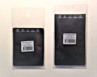 May include: Two black fabric tip sleeves for a sewing machine. The sleeves are packaged in clear plastic bags. The smaller sleeve is 4 inches long and the larger sleeve is 5 inches long. The sleeves are labeled with the text "TWIST MINI Tip Sleeve" and the size and item number.