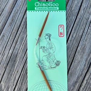 May include: A package of Chiaogoo Premium Bamboo circular knitting needles. The needles are brown with silver tips and a clear cable. The package is light green with the brand name and a drawing of a woman knitting.