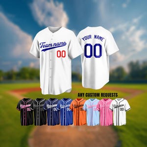 May include: White baseball jersey with "Team name" and the number "00" in red. The back of the jersey has "YOUR NAME" and the number "00" in blue. Additional jerseys in various colours are displayed.