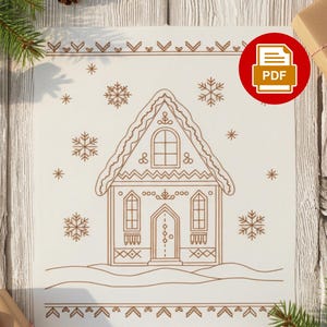 May include: A detailed line drawing of a gingerbread house with snowflakes and decorative borders. The image is in shades of brown on a cream background, with a PDF icon in the upper right corner. Christmas-themed.
