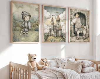 May include: Three framed watercolor prints depicting a knight, a castle, and a horse with a crown. The prints have a soft color palette of greens, blues, and browns. The artwork is displayed above a child's bed with teddy bears and pillows.