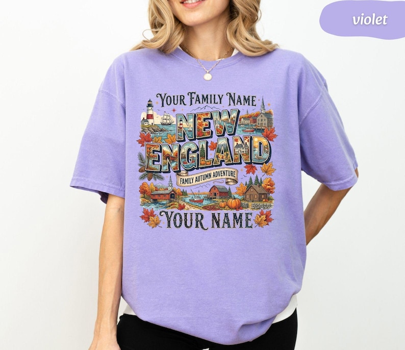 May include: A violet short-sleeve t-shirt featuring a graphic print with the text "YOUR FAMILY NAME", "NEW ENGLAND", "FAMILY AUTUMN ADVENTURE", and "YOUR NAME". The design includes illustrations of a lighthouse, autumn leaves, and buildings.