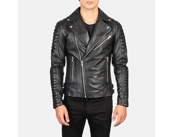 May include: Black leather motorcycle jacket with a notched collar, asymmetrical zipper closure, and quilted detailing on the shoulders and sleeves. The jacket has multiple zippered pockets and a classic biker style.