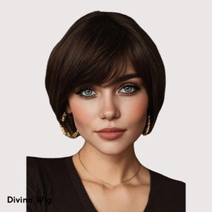 May include: A short, dark brown wig with a side-swept bang. The wig is styled in a classic bob cut. The model is wearing gold hoop earrings and a brown top. The text "Divina Wig" is visible in the bottom left corner.