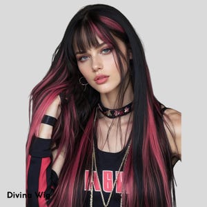 May include: Long black wig with pink highlights and bangs. The wig features long, straight hair with a dark base and vibrant pink streaks. The model is wearing a black top with red stripes and a black choker.