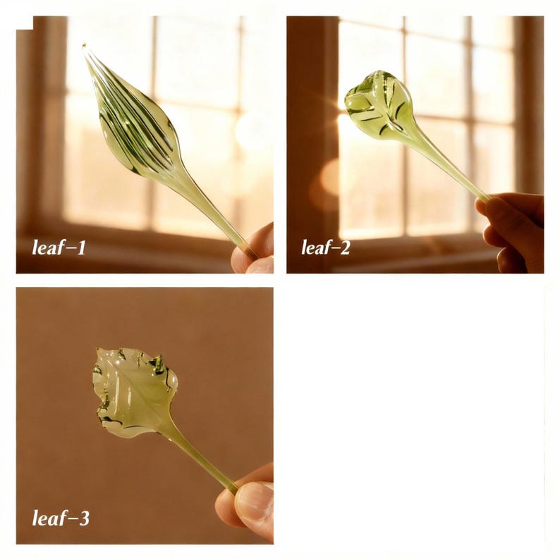 May include: Three glass leaf sculptures in varying shapes and designs. Each leaf is a pale green color with delicate veining details. The text "leaf-1", "leaf-2", and "leaf-3" are visible in the image.