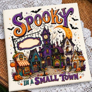 May include: A square sign featuring the text SPOOKY IN A SMALL TOWN with a colorful illustration of a haunted village. The scene includes a clock tower, small shops, pumpkins, ghosts, bats, and a crescent moon, all rendered in purple, orange, and yellow.