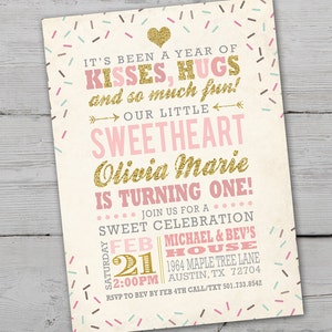 May include: A pink and gold birthday invitation with a sprinkle pattern background. It says "It's been a year of kisses, hugs and so much fun! Our little sweetheart Olivia Marie is turning one!"  Join us for a sweet celebration on Saturday, February 21st at 2:00 PM at Michael & Bev's House, 1964 Maple Tree Lane, Austin, TX 72704. RSVP to Bev by February 4th. Call/Text 501.733.8542.