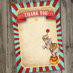 May include: A vintage-style thank you card with a red and blue striped border. The card features a cartoon elephant balancing a ball on its trunk. The text "*** THANK YOU ***" is printed on a red ribbon banner at the top of the card.